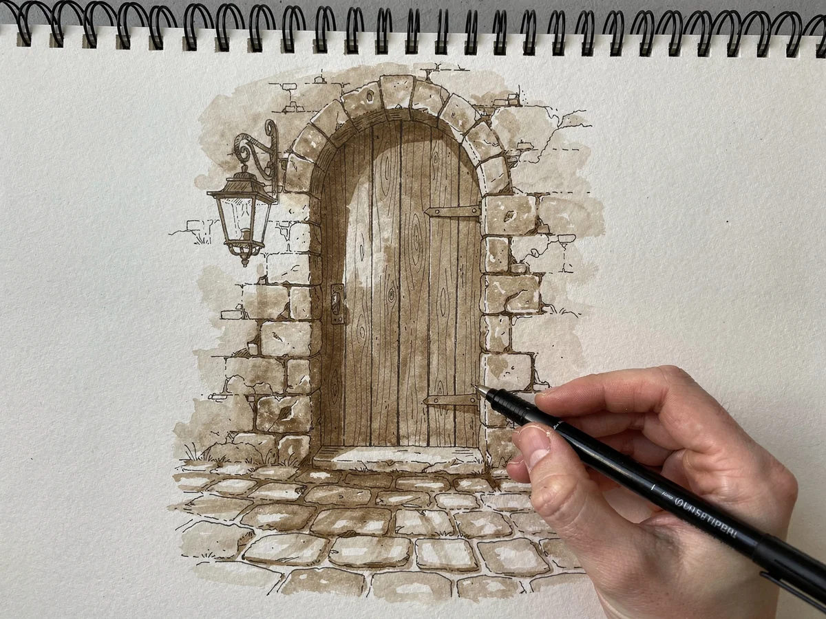 Pen and ink sketch of an old wooden doorway with stone surrounds, drawn in sepia tonal ink linework
